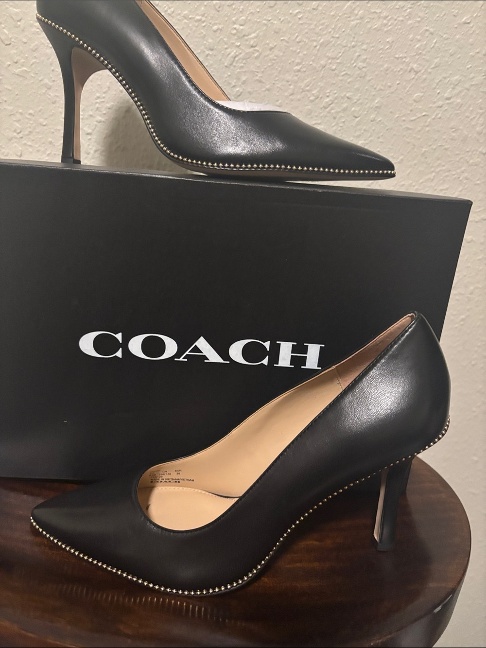 Coach Black Leather Pointed-Toe Pumps with Gold Stud Trim